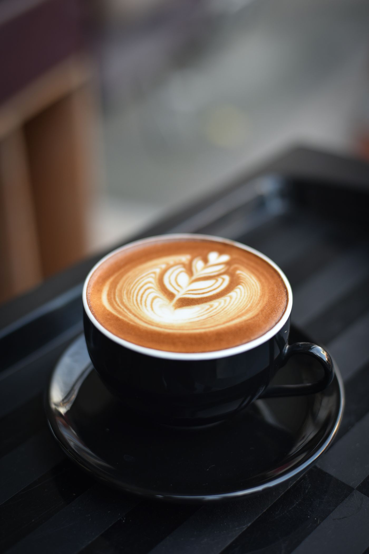 Close-up of kopi cup showing colour and condensation